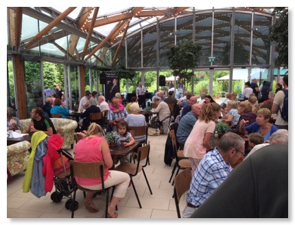 Tom Wyllie singing at Alnwick Garden Cafe