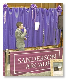 Tom Wyllie sings to open Curiously Wicked, Sanderson Arcade, Morpeth